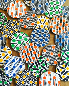 round cork coasters in yellow, orange, blue and green.  Melamine coasters made in the UK