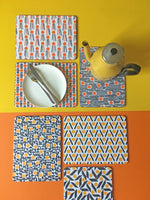 Load image into Gallery viewer, Orange and yellow cork placemats
