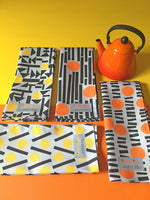 Load image into Gallery viewer, Orange and yellow teatowels
